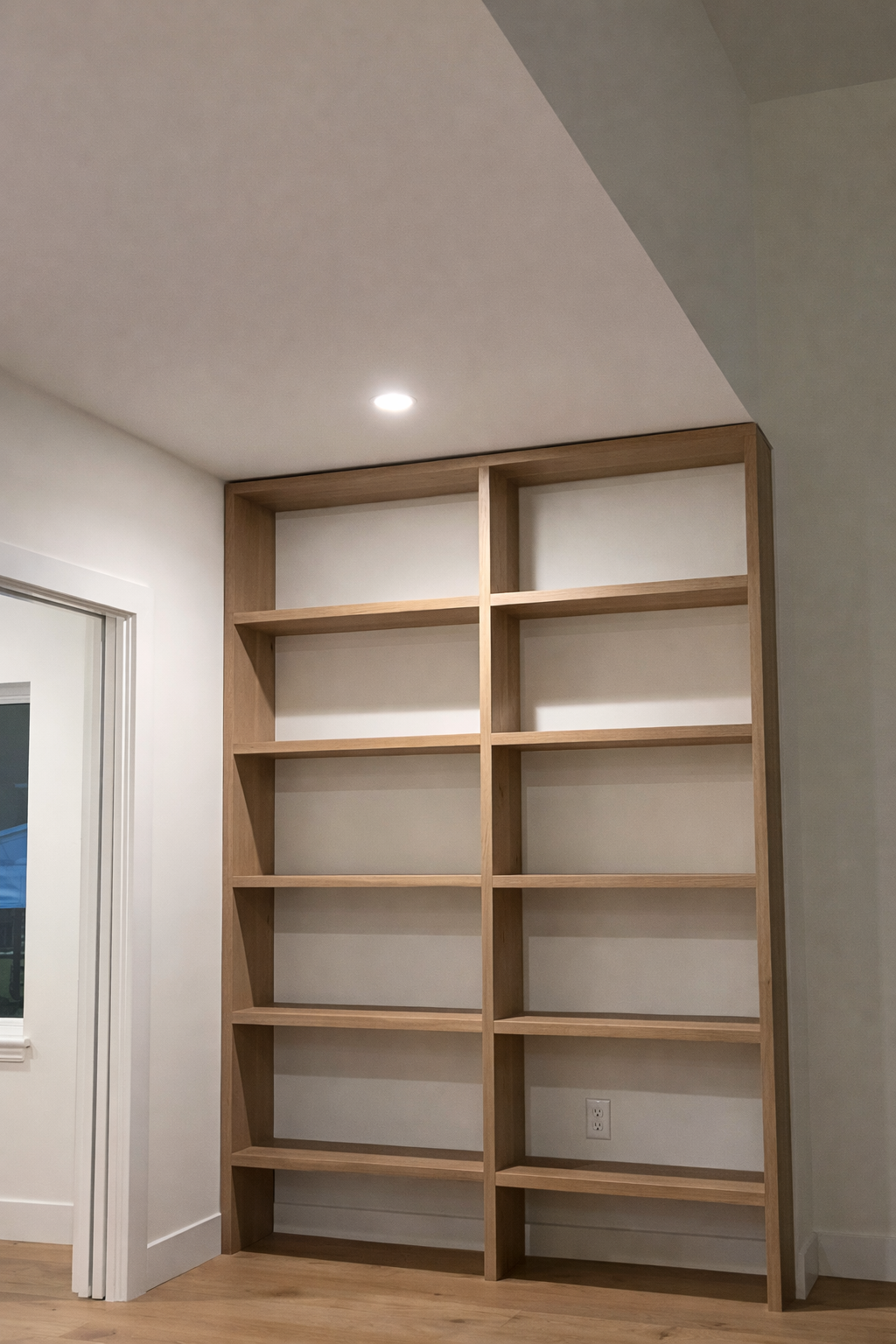 Custom white oak bookshelf built-in shelving Jacksonville FL